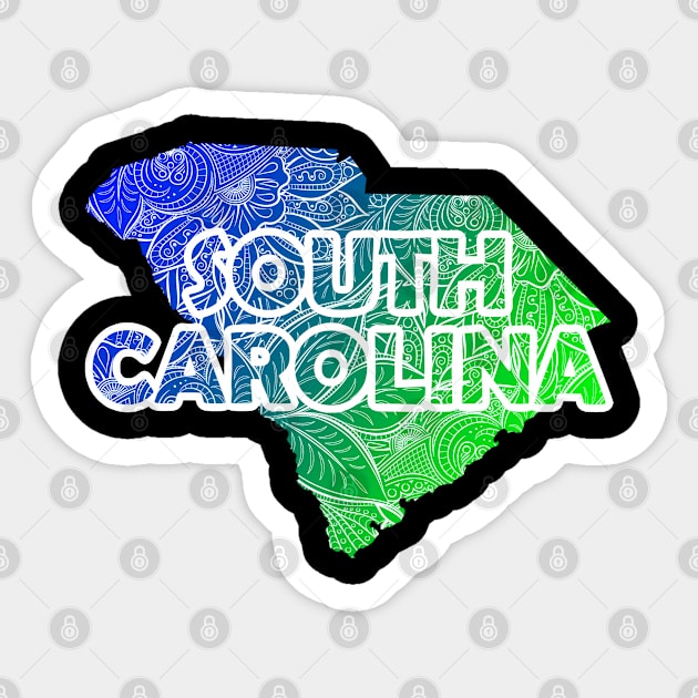 Colorful mandala art map of South Carolina with text in blue and green Sticker by Happy Citizen